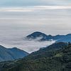Wolkenvelden vanaf de Stille Oceaan in de Andes uitlopers van Ecuador sur Lex van Doorn