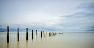 Poles at the beach before a storm by Sjoerd van der Wal Photography