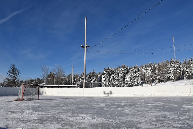 The village ice rink in winter by Claude Laprise
