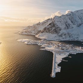 Winter sunrise above Reine, Lofoten, Norway. Drone view over fjord and mountains by Marion Stoffels