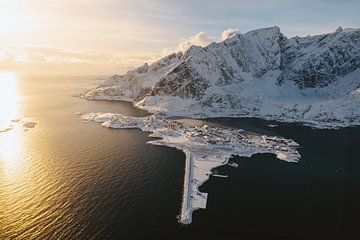 Winter sunrise above Reine, Lofoten, Norway. Drone view over fjord and mountains by Marion Stoffels