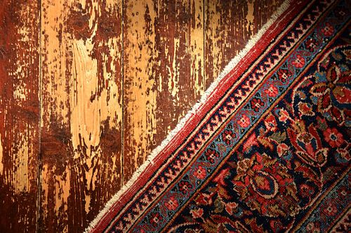 Vintage carpet on wooden floor