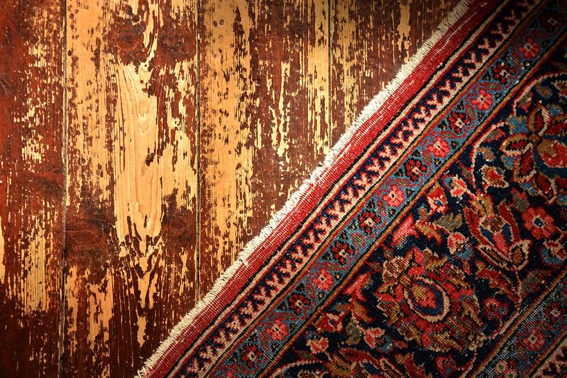 Vintage carpet on wooden floor by Lenna Teklenburg