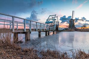 Zonsondergang molens Kinderdijk in de winter