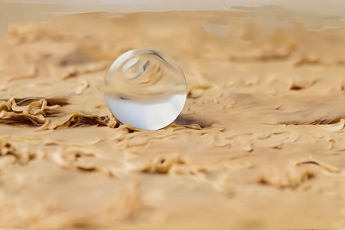 Glass ball in the sand