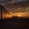 Strandhuisjes bij zonsondergang van Bart van Dam