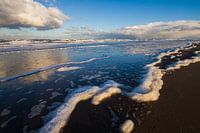 Sea foam washed up on beach in Katwijk