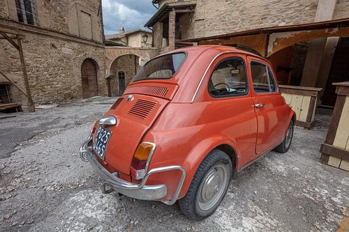 Old Fiat 500 in square in Bevagna, Italy