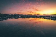 Fuerteventura, zonsopgang op een stenen strand met reflectie in een plasje van Fotos by Jan Wehnert thumbnail