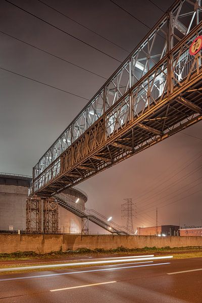 Pipeline bridge near a silo at night in industrial area, Antwerp by Tony Vingerhoets