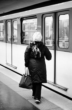 Paris - Lady waits for metro -Black and white by Eline Willekens