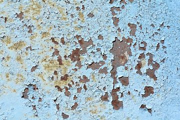 flaking blue paint on rusty metal by Heiko Kueverling
