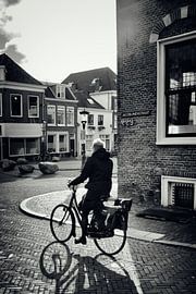 Street photography in Utrecht. The cyclist on Jacobijnenstraat. by André Blom Fotografie Utrecht