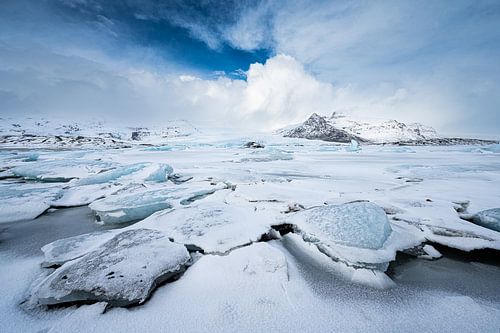 Ice floes lake Fjallsarlon. Snowy. by Danny Leij