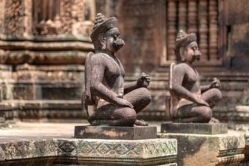 Temple guards at the Banteay Srei temple complex at Angkor. by Rick Van der Poorten