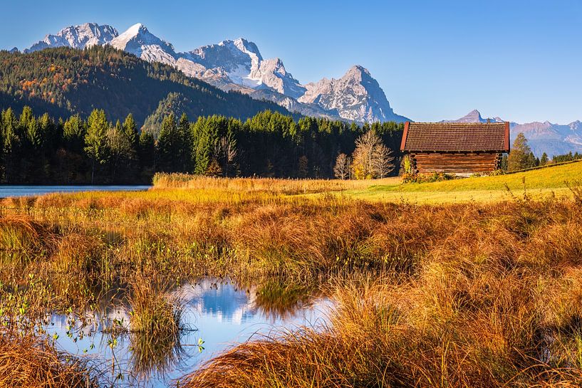 Wooden hut by the mountain lake by Daniela Beyer