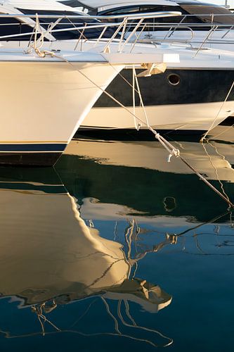 Details of boats and their reflections