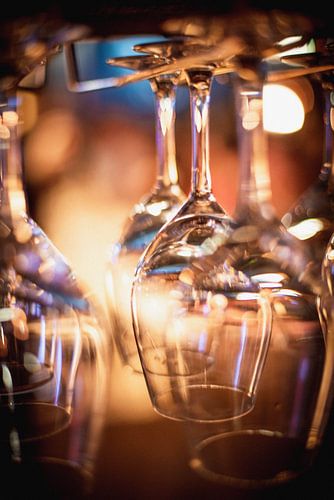 Wine glasses hung in a restaurant