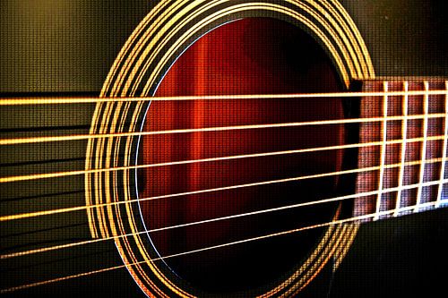 Guitar strings of an acoustic guitar mixed media