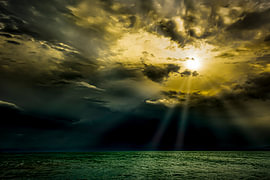Sun breaks through storm clouds over Lake Constance by Dieter Walther