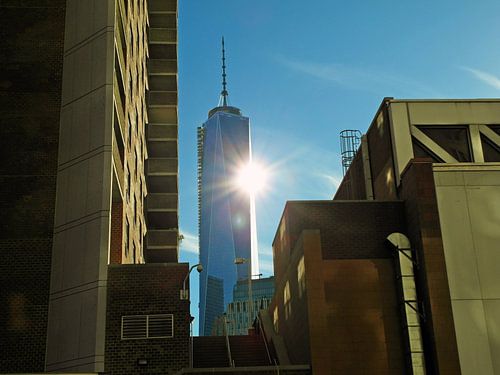 Empire State Building with sun and moody concrete