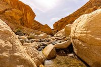 An impressive and colourful natural landscape of Middle Eastern rock formations between the gorge of the Wadi Ghuweir Trail, Dana Biosphere Reserve, Jordan