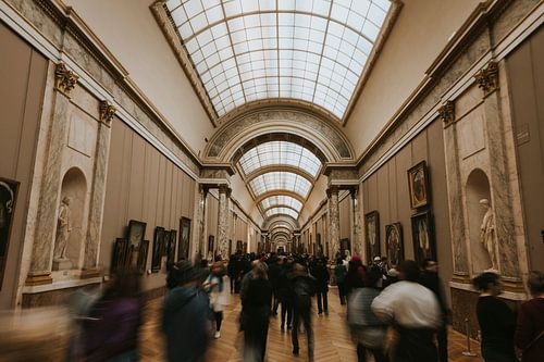 Crowded Louvre series. Motion blur in the main hall, Paris France