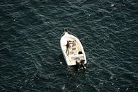 Fisherman alone in the sea