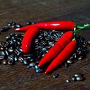 Fresh coffee beans and red hot chilli pepper by Silva Wischeropp thumbnail