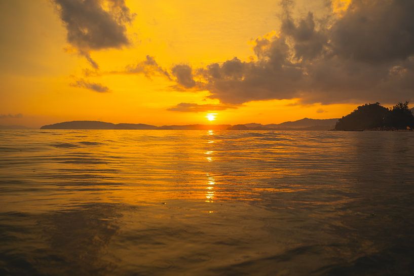 Beautiful sunset on the Aon Nang beach in Thailand. by Lennert Degelin
