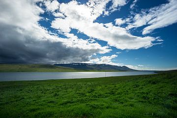 Iceland - Dark thunderstorm coming over blue fjord by adventure-photos