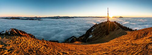 At sunset, the Allgäu Alps present themselves out of the sea of fog and show a great atmosphere abov