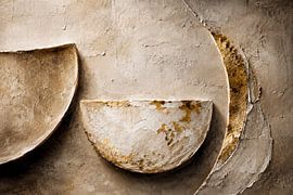Sculptural harmony in limestone and gold