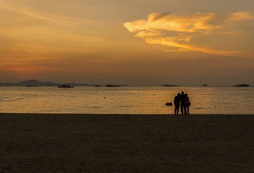 Three people on a beach in Thailand