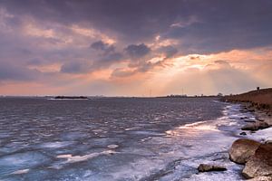 Sunlight at the ice of the Markermeer by Freek Rooze