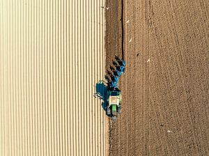 Tractor preparing the soil for planting crops