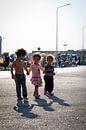 Three young girls walking hand in hand in Greece | Photography art print portrait by Milene van Arendonk thumbnail