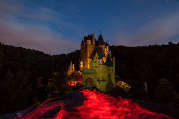 ghostly Eltz Castle whit light painting 