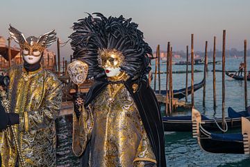 Carnival in Venice - Costumes in front of the gondolas on St. Mark's Square by t.ART