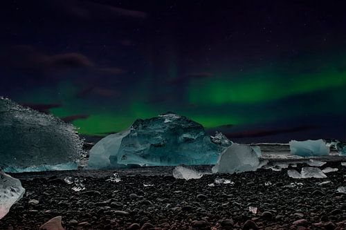 Northern Lights beach Iceland, Aurora Borealis and blue ice.