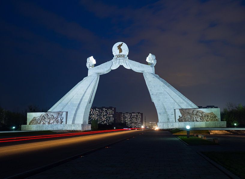 Traffic to Pyongyang under the arch of reunification in North Korea by Teun Janssen