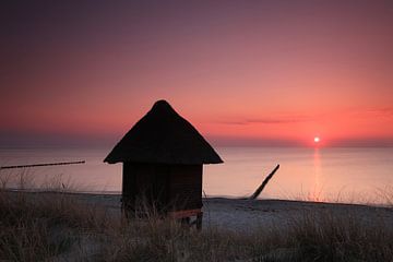 Hut on the beach at sunset