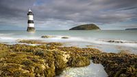 Lighthouse firmly anchored in sea