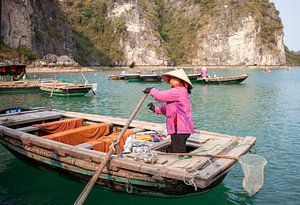 Ferrywoman in floating village in Vietnam by t.ART