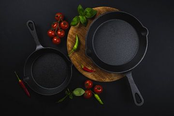 Cast iron pan and tomatoes, cast iron pan with tomatoes by Corrine Ponsen