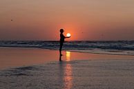 Silhouette of a woman with the sun in her hands by Wad of Wonders thumbnail