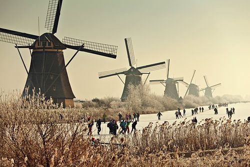 Ice skating in front of the windmills of Kinderdijk by Frans Lemmens
