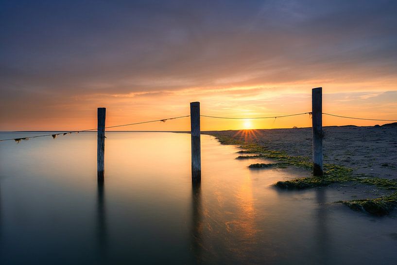 Sunset beach van Björn van den Berg
