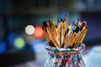 Brushes in a paint pot