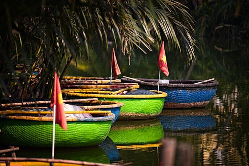 Serene reflections of colourful Vietnamese boats